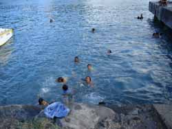 Local children play in the water